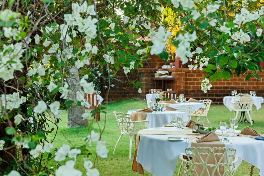 Outdoor dining furniture at Swaswara CGH earth, Gokarna