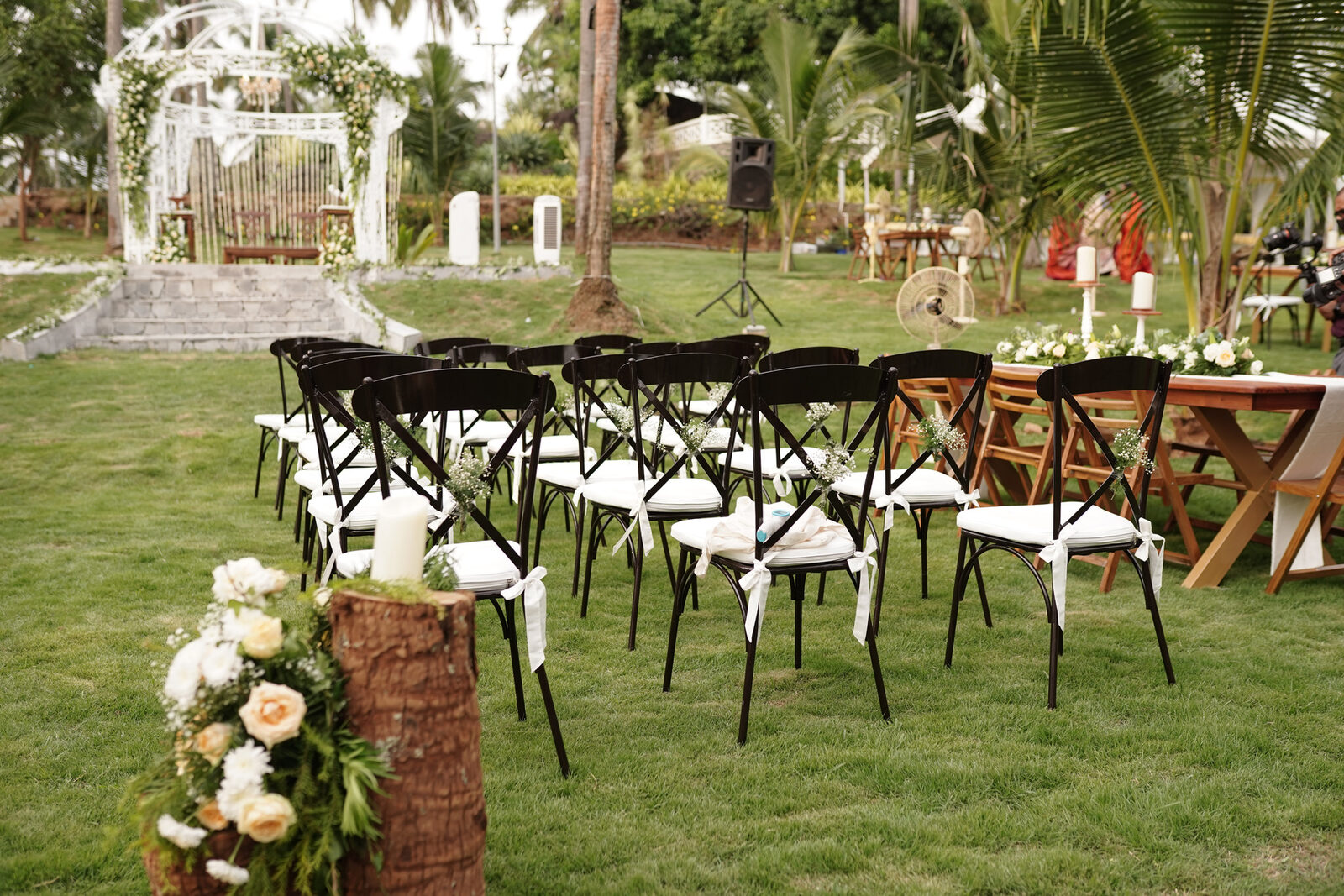Wedding ceremony seating arrangement with floral gazebo