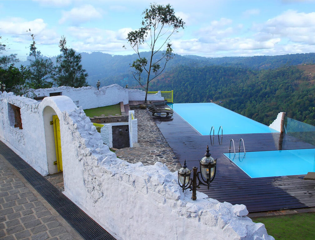 Infinity pool deck with concealed lamp posts, Hills and Hues, Thekkady