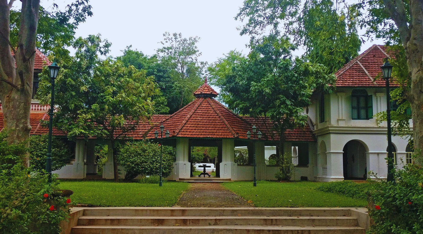Cast iron one-headed and three-headed lamp posts at Kalari Kovilakam, CGH Earth
