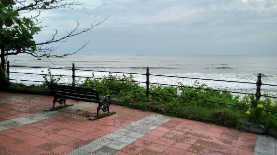 Customised cast iron and wooden bench overlooking Payyambalam Beach